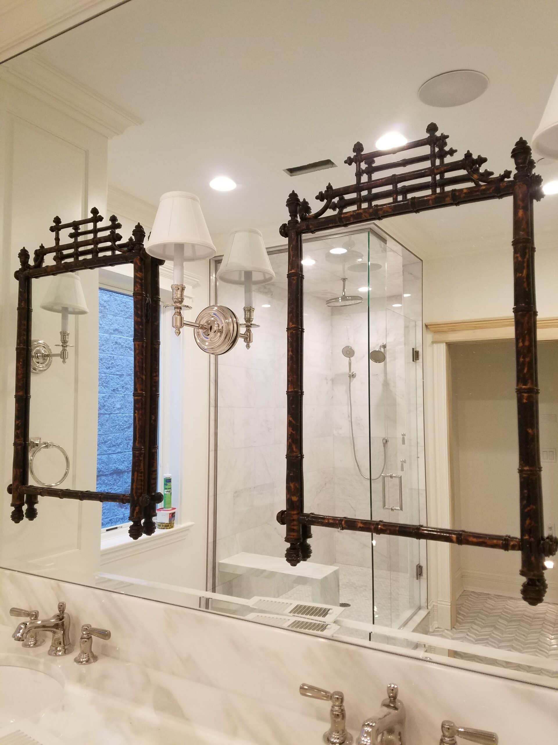 A bathroom redesign in a Chicago home with unique mirror fixtures.